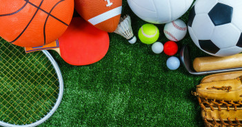 Sports Equipment on green grass, Top view